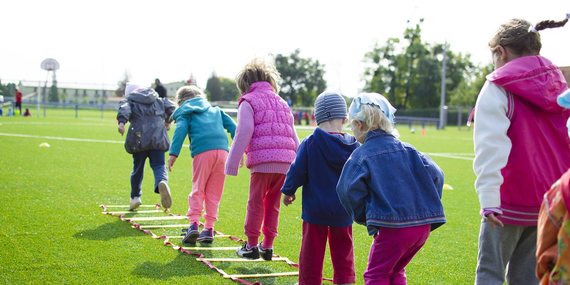 Kids together in jumping competition